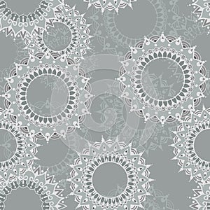 Seamless pattern with circular floral ornaments