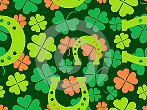 Seamless pattern with clover leaves and horseshoes for St. Patrick\'s Day. Clover leaves and a horseshoe