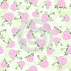 Seamless pattern with clover on the polka dots background