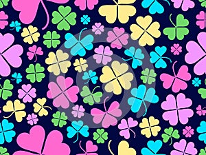 Seamless pattern with clover for Saint Patrick`s Day. Multi-colored four-leaf clovers on a dark background