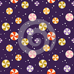 Seamless pattern with colorful circle candy on purple background. Design for textile