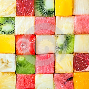 Seamless pattern of colorful fresh fruit cubes