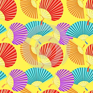 Seamless pattern colorful Japanese fan of on a yellow background