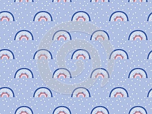 Seamless pattern of cute abstract rainbows on a gentle blue background with white drops. Endless Scandinavian texture. Perfect for