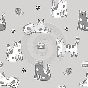 Seamless pattern with cute cartoon cats on gray background