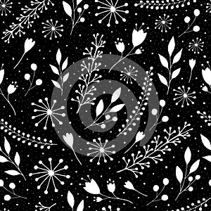 Seamless pattern with cute flowers and sprigs on a black background