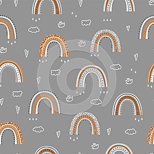 Seamless pattern with a cute rainbow.