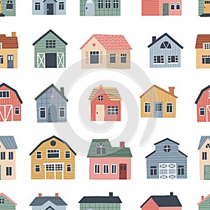 Seamless pattern with cute village houses. Hand drawn vector illustration for nursery textile or wallpaper design