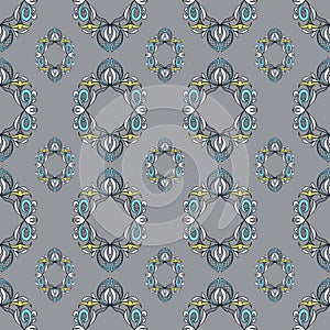 Seamless pattern of decorative colored floral elements. Lace pattern on a gray background