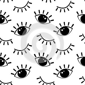 Seamless pattern, drawn cartoon black eyes on a white background, open and closed eyes. Print, textile