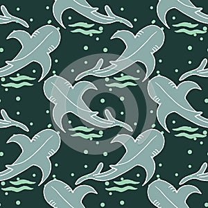 Seamless pattern, drawn killer whale and bubbles on a turquoise background. Marine animals for children's textiles, prints