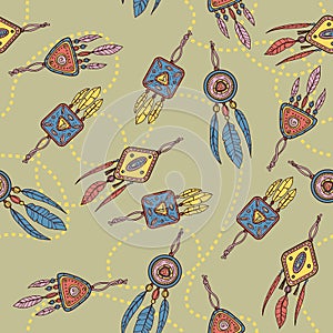 Seamless pattern with dreamcatcher, feathers and beads.