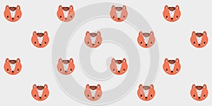 Seamless pattern of faces of little cute foxes on a white background. Vector.