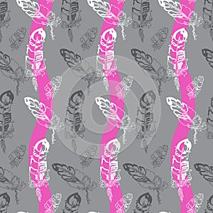 Seamless pattern with feathers on a striped background.