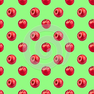Seamless pattern of fresh red apples on green background isolated, bright shiny apple repeating ornament, tasty juicy ripe fruits