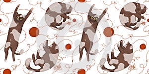 Seamless pattern with funny cats with balls of yarn.