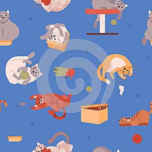 Seamless pattern with funny playing cats on blue flat vector illustration.
