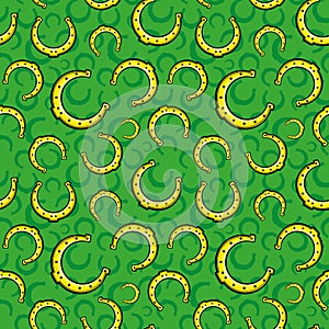 Seamless pattern with golden horseshoes.