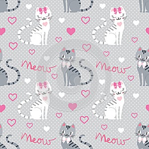 Seamless pattern with gray and white cats on a gray background. Vector
