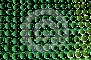 Seamless pattern of green earthen pots kept in linier position.