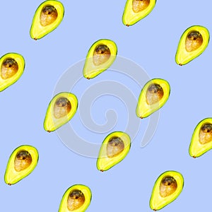 Seamless Pattern of Halves of Ripe Avocado on blue background, Healthy oily food, Keto diet
