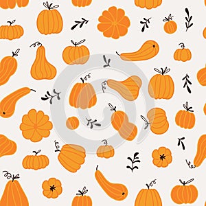 Seamless pattern with hand drawn pumpkins and leaves. Cute design  for Halloween or Thankful day.