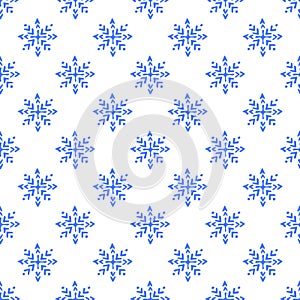 Seamless pattern with hand drawn snowflakes isolated on white