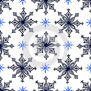 Seamless pattern with hand drawn snowflakes isolated on white