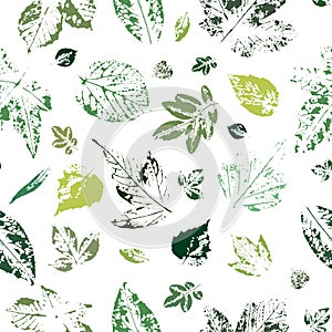 Seamless pattern with imprints of green leaves on a white background.