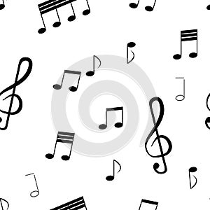 Seamless pattern: isolated music notes and musical key of black color on a white background.