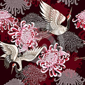 Seamless pattern with Japanese white cranes and chrysanthemums on a claret background for textile design