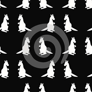 Seamless pattern with kangaroos on a black background. Vector illustration.