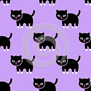 Seamless pattern. Kitten on a purple background. photo