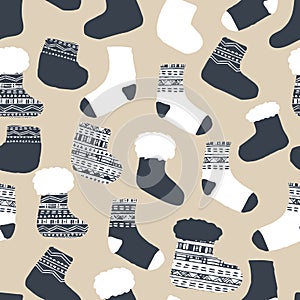 Seamless pattern of knitted socks. Vector illustration for Christmas winter time in blue white beige colors