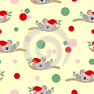 Seamless pattern with koala babies in red Christmas hats sleeping on eucalyptus branches. Yellow background. Pink, red and green