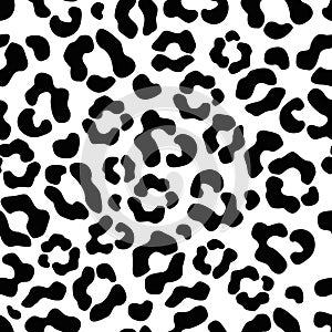 The seamless pattern of large black and white spots imitates the skin of a leopard