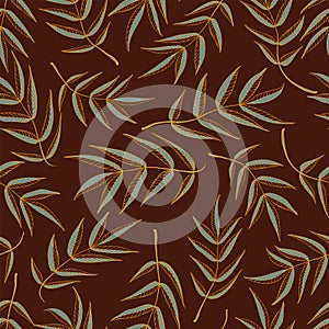 Seamless pattern from leaves of mountain ash in brown and gold tones