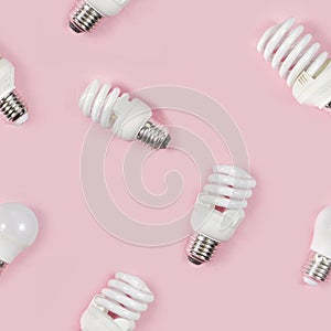 Seamless pattern with LED light bulbs pink background minimal style. Energy-saving and eco-friendly life