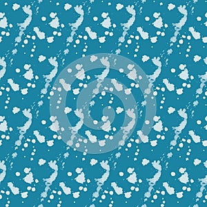 Seamless pattern with light stains and spray on blue background