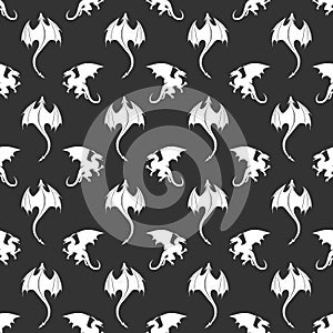 Seamless pattern made up of white dragons and wyverns on the black background.