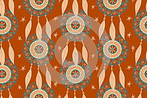 Seamless pattern with magic dream catchers with beads, feathers on a terracotta background. Vector illustration, retro pattern,