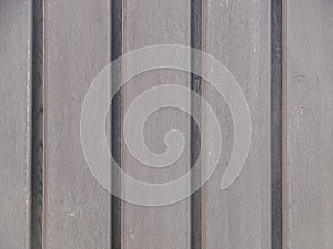 Seamless pattern of modern wall covering with vertical wooden slats for background.