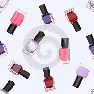 Seamless pattern of nail polish bottles on white background