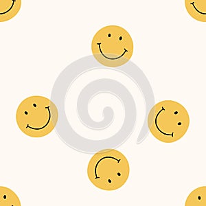 Seamless pattern with orange smiling faces on a light background