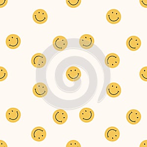 Seamless pattern with orange smiling faces on a light background