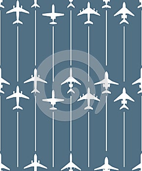 Seamless pattern with passenger airplanes and flight lines