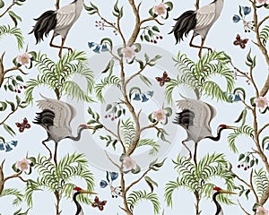 Seamless pattern with peony bushes and cranes in chinoiserie style. Vector.