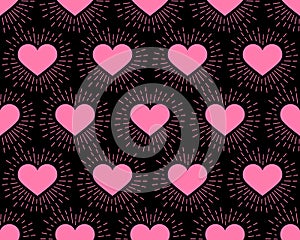 Seamless pattern. Pink Hearts with rays on a black background. Vector illustration. The idea for holiday designs