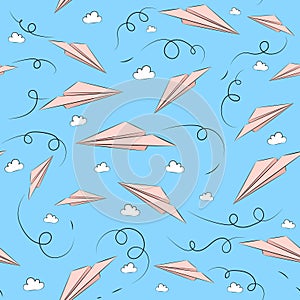 Seamless pattern with pink paper airplanes and clouds photo