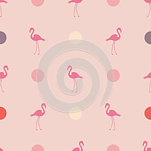 Seamless pattern in pink pastel colors with flamingos and polka dots.